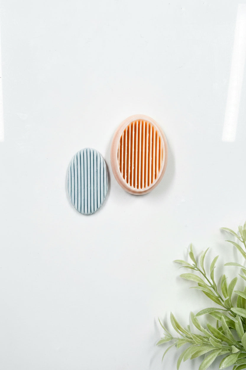 Petal & Posy simple striped long oval polymer clay cutter showing a striped oval shape for crafting and jewelry making.