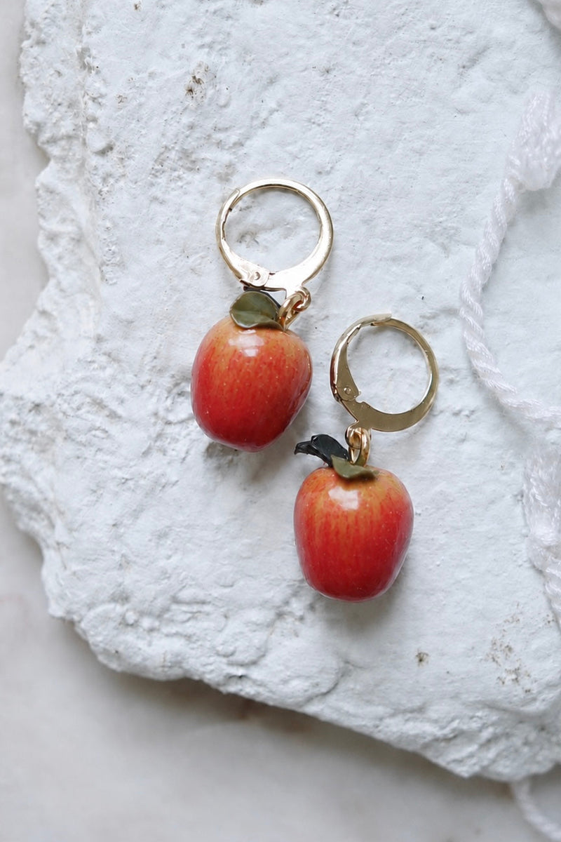 Petal & Posy Apple a Day polymer clay hoop earrings featuring colorful apple-shaped designs on lightweight hoops.