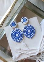 Petal & Posy Boardwalk polymer clay dangling stud earrings with colorful, artistic design on white background.