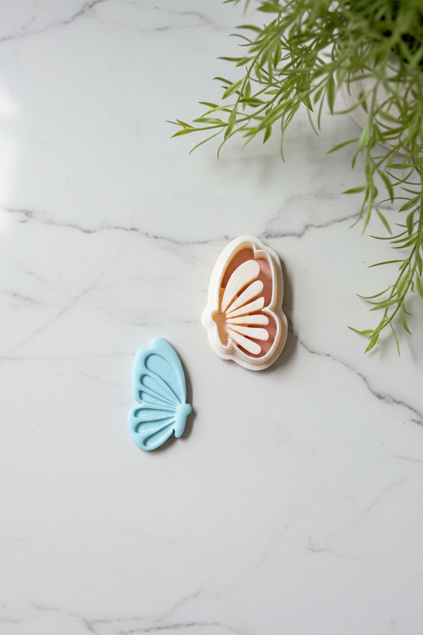 Petal & Posy butterfly embossing polymer clay cutter set with detailed butterfly shapes for crafting and jewelry making.