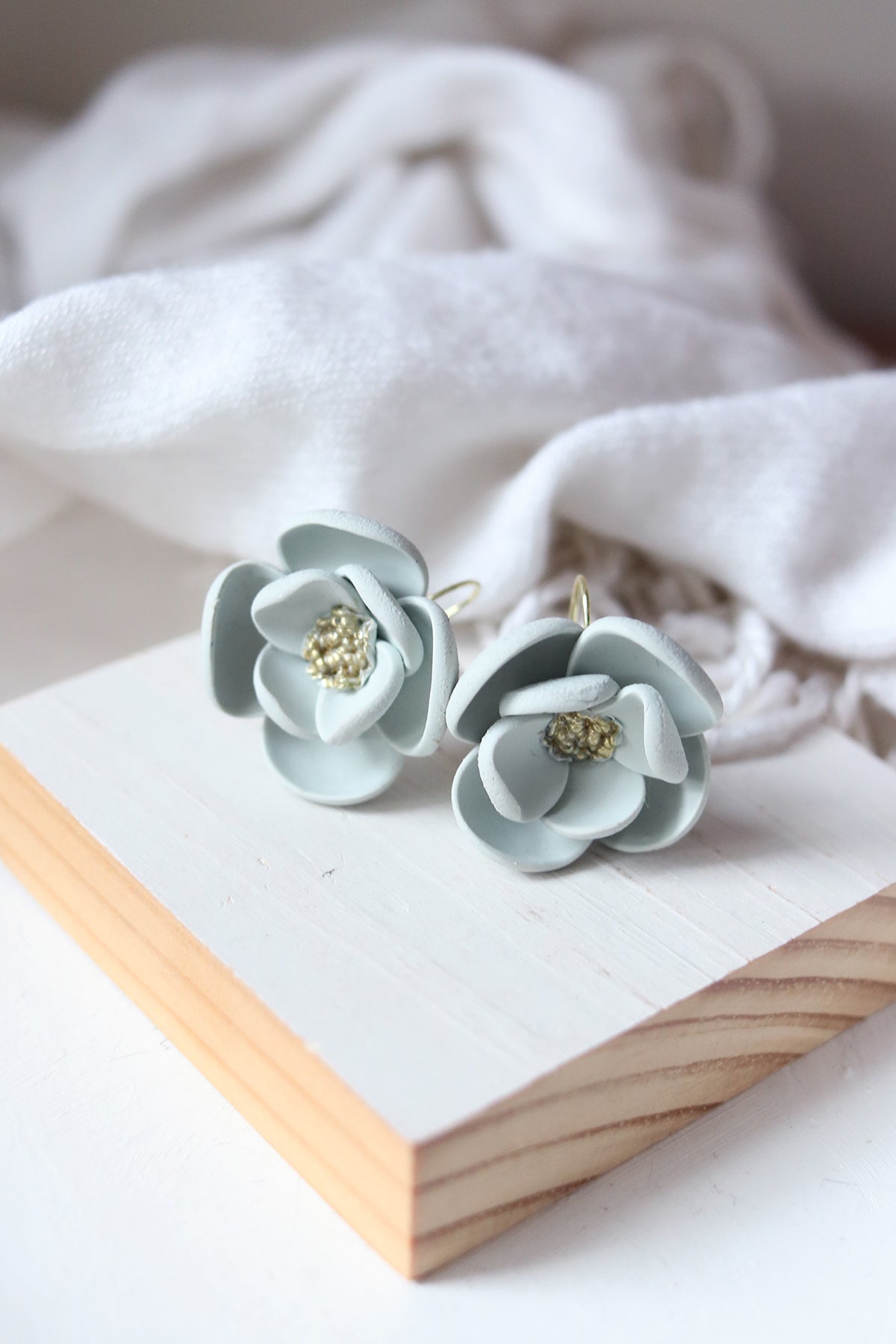 Petal & Posy Eventide Bloom hook earrings in fog color, showcasing delicate floral design and elegant jewelry style.