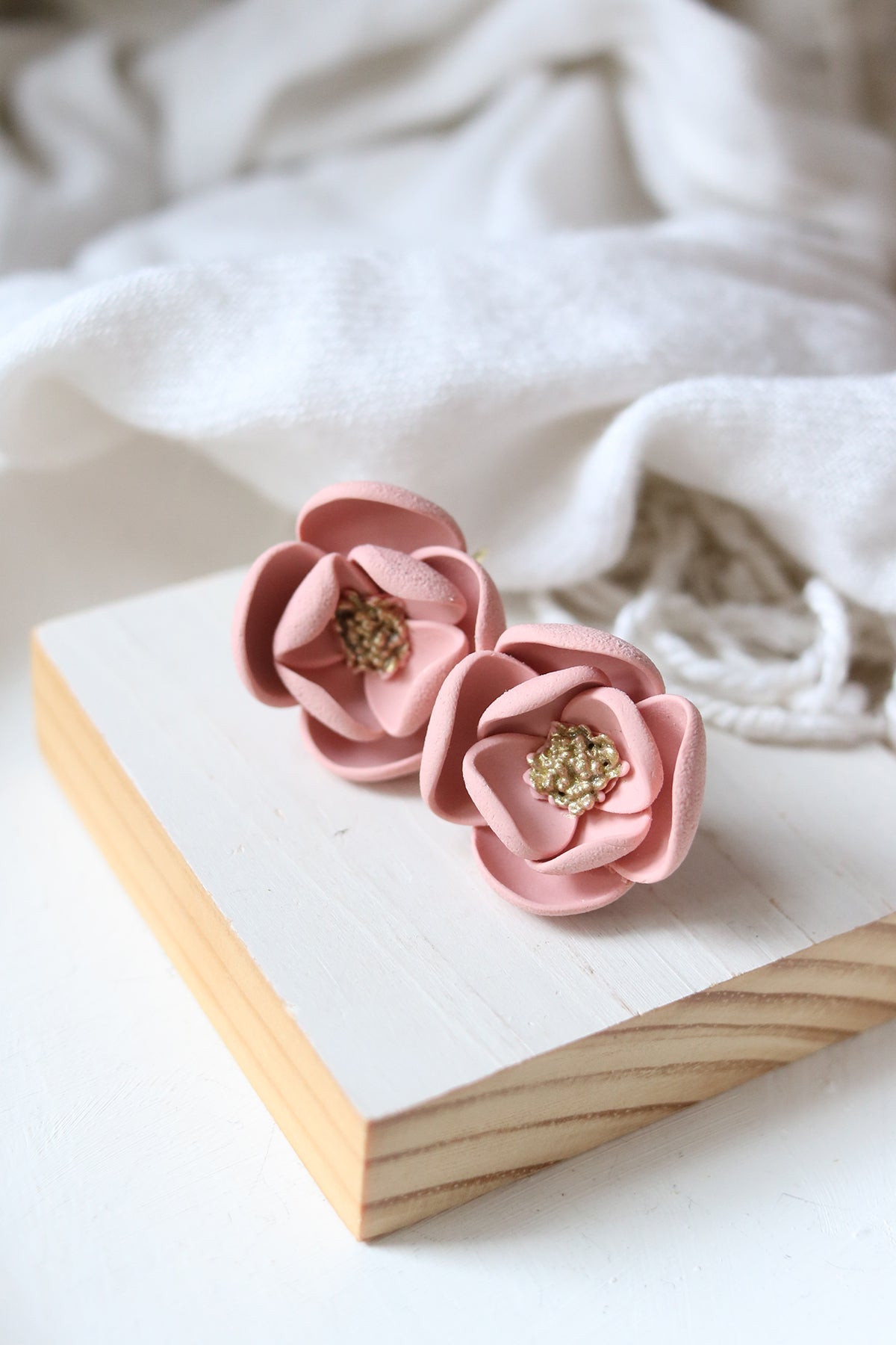 Petal & Posy Eventide Bloom hook earrings in fresco color, featuring delicate floral design on lightweight jewelry.