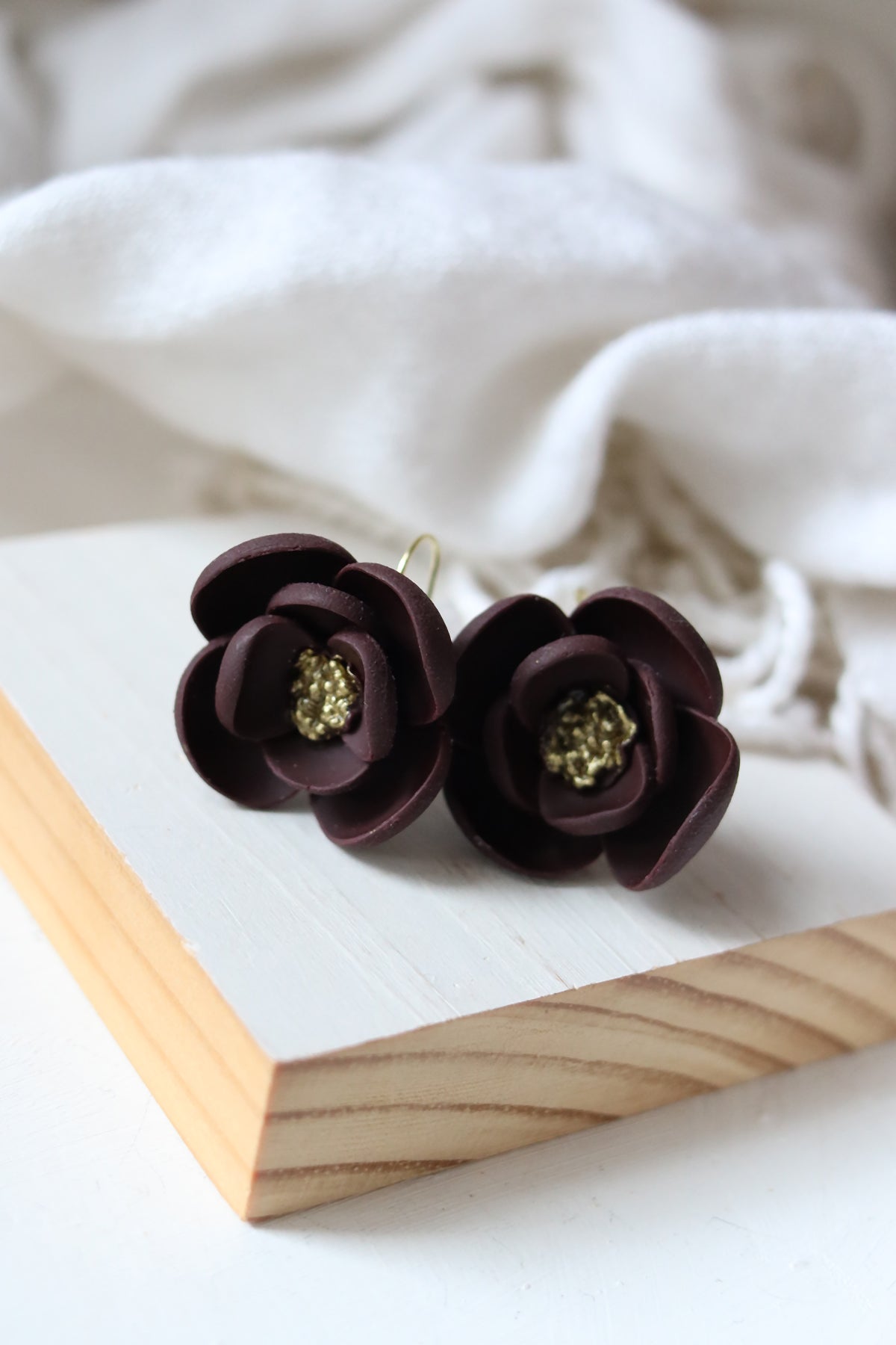 Petal & Posy Eventide Bloom Hook Earrings in mulberry color, featuring floral design and elegant dangle style.