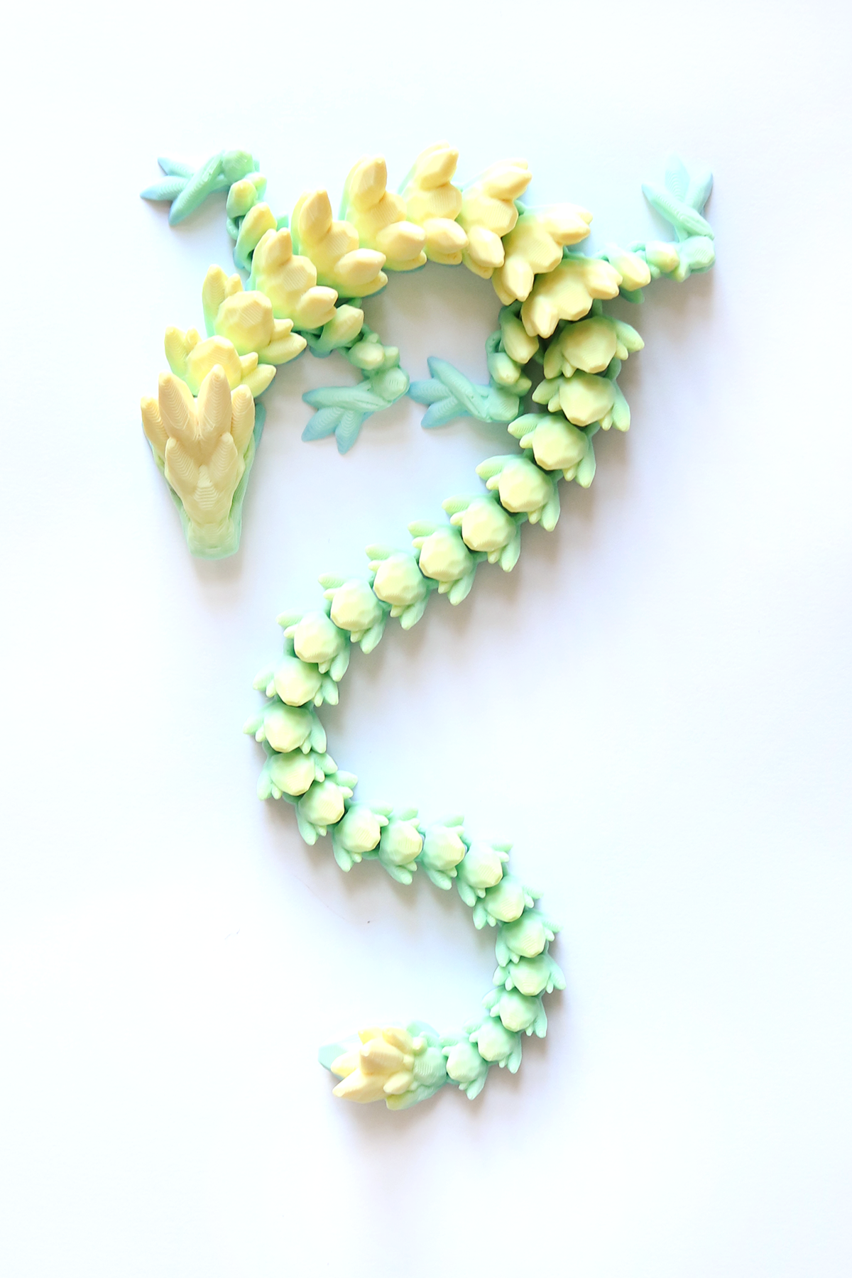 3D Printed Long Gemstone Dragon Fidget Pet in Banana