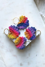Rainbow polymer clay hook earrings with prism plume design by Petal & Posy, showcasing vibrant colors and intricate details.