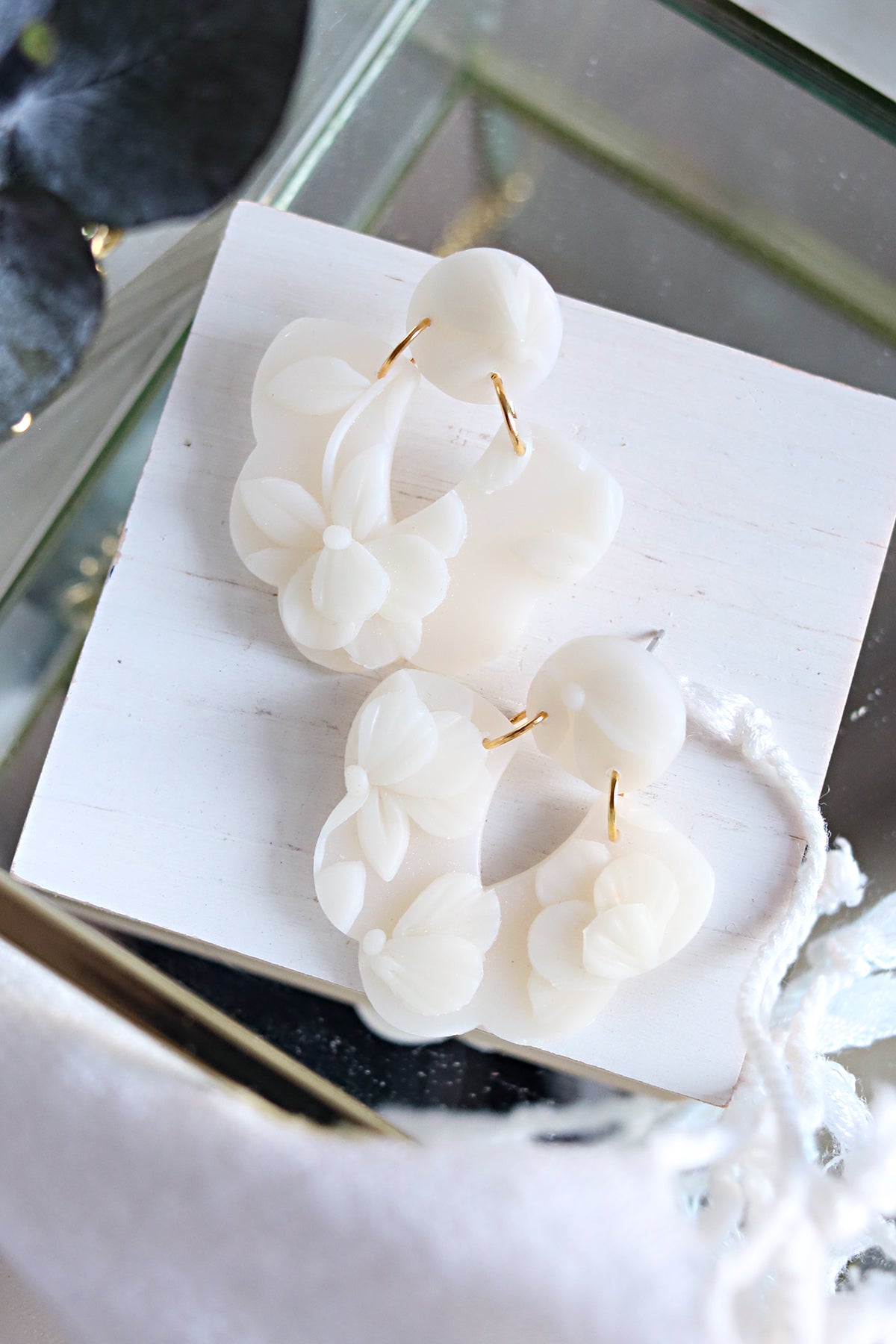 Petal & Posy Magnolia earrings featuring elegant dangle stud design with detailed magnolia flower motifs.